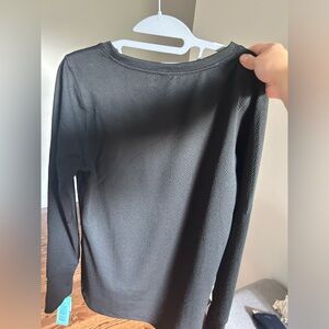 Black textured MTA woman’s long sleeve workout tee